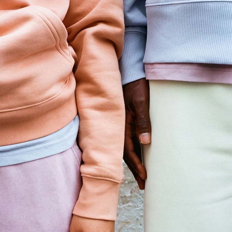Man and women with soft coloured clothing